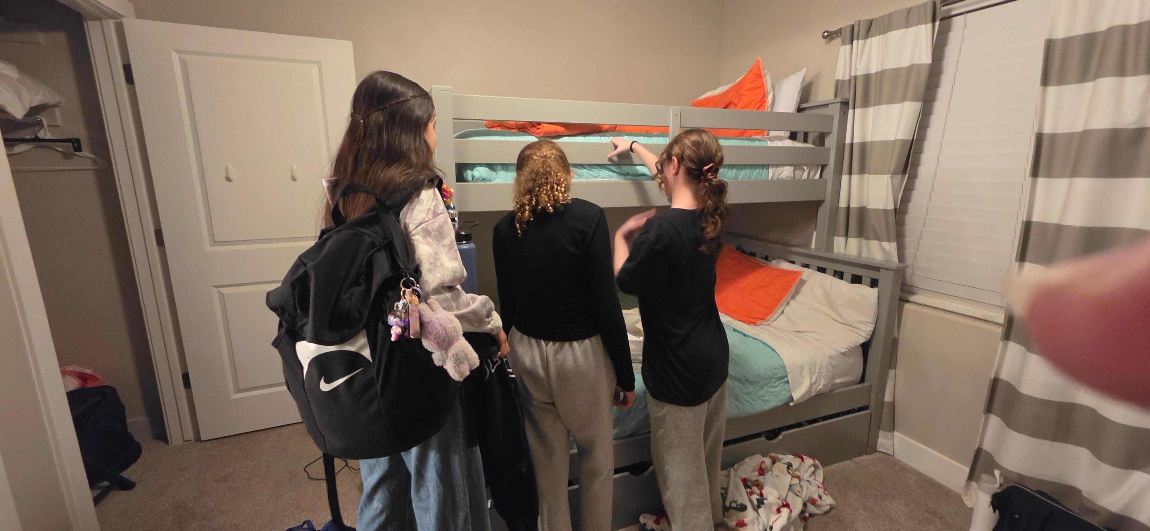 The kids checking out their room 