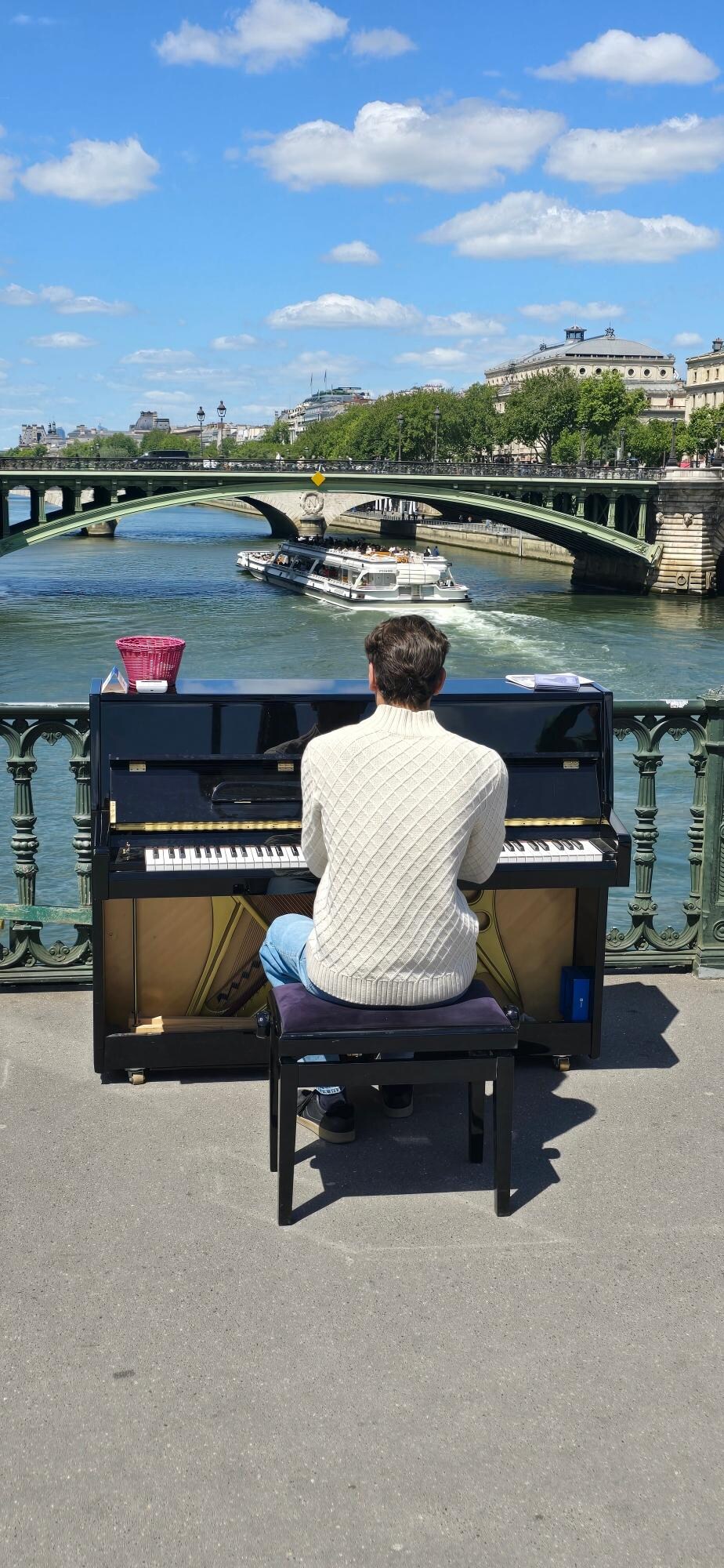 Random Paris piano player overlooking the Seine 