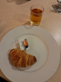 Breakfast, micro croissant and one of two marmalade packets in the buffet.