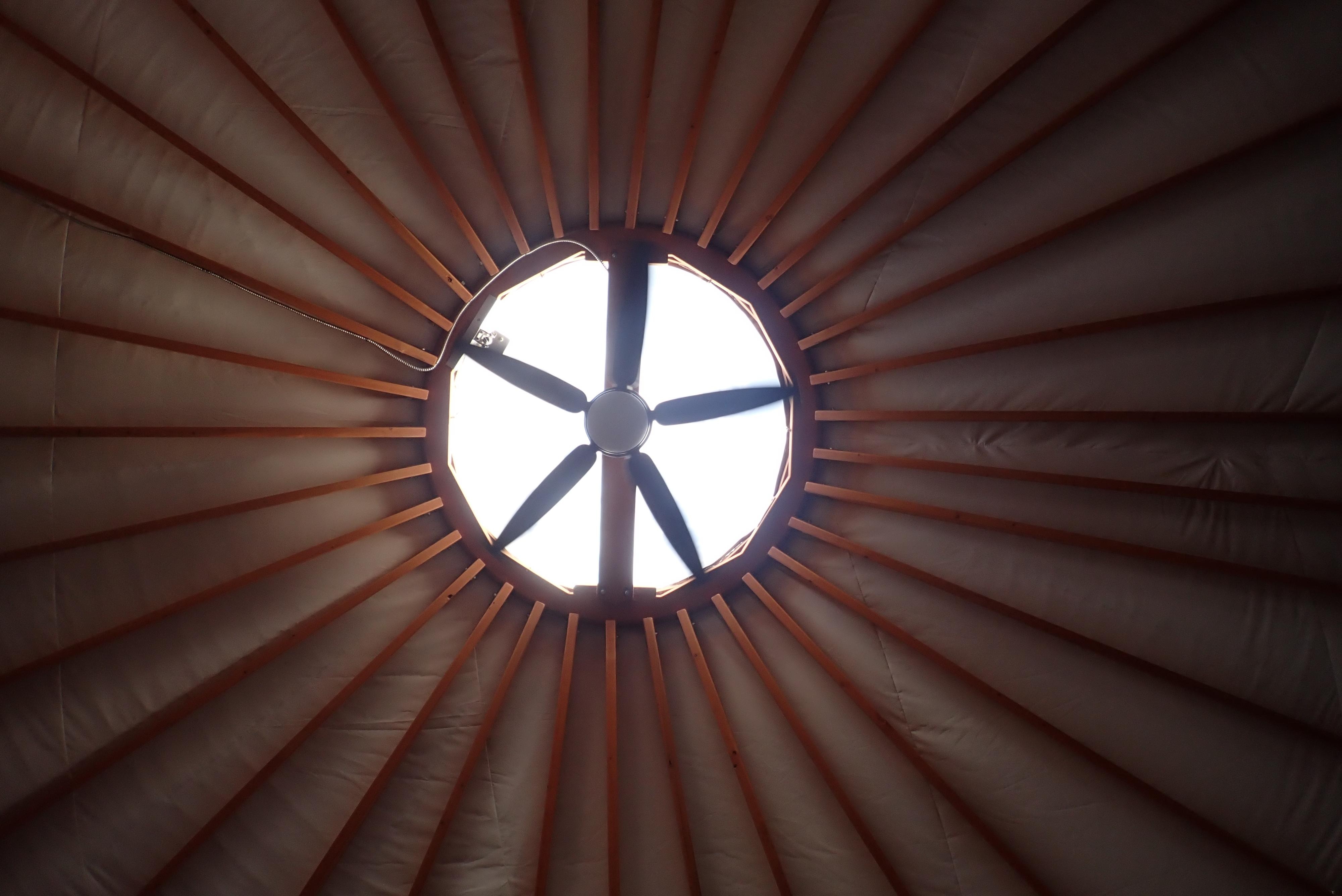 The skylight and ceiling fan in Yurt