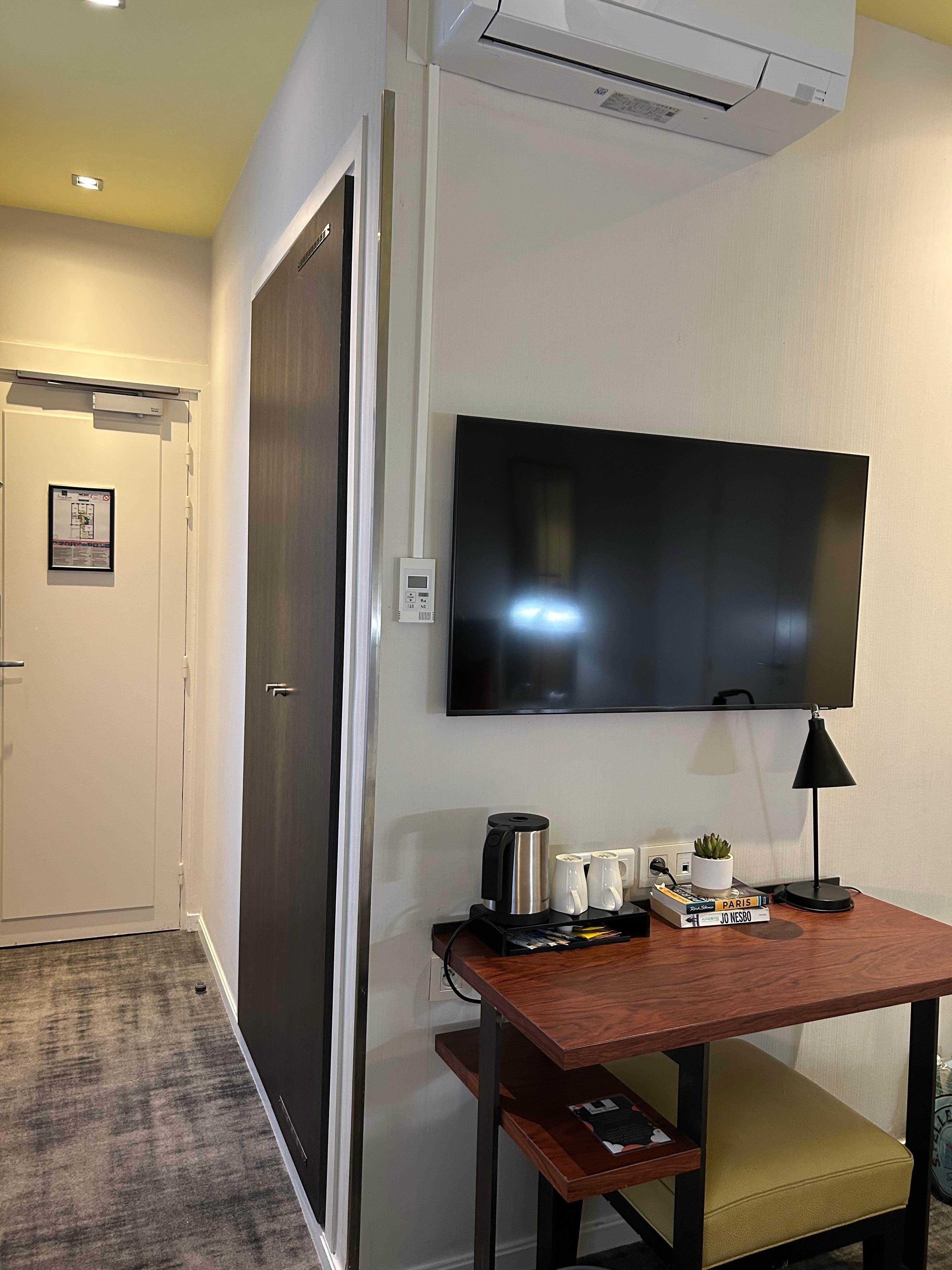 Entry hall with large closet, hangers, and safe