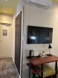 Entry hall with large closet, hangers, and safe