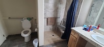 Toilet area with rail was spacious and there's a large chair for the shower