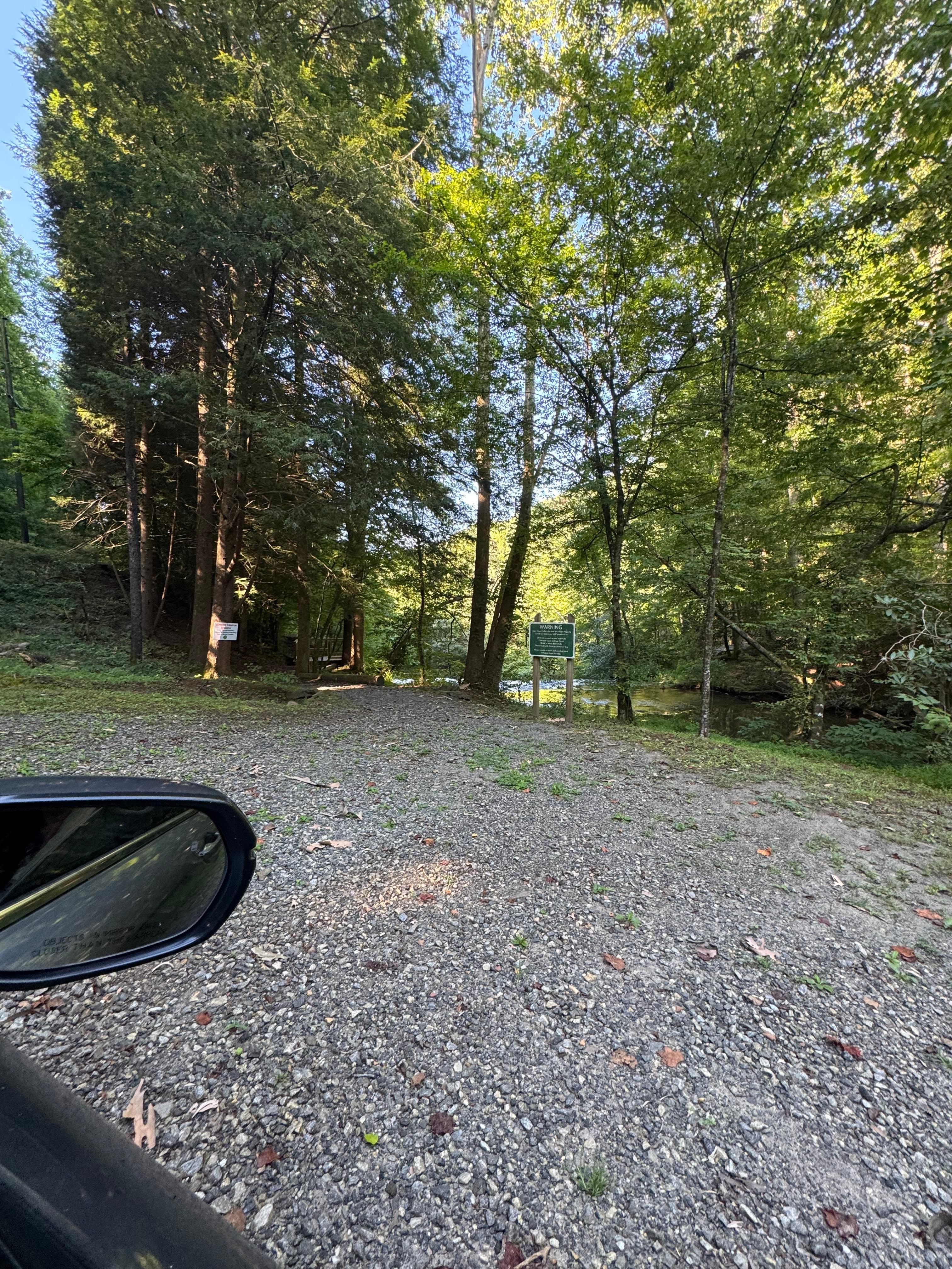 View of top falls lookout area from driveway 