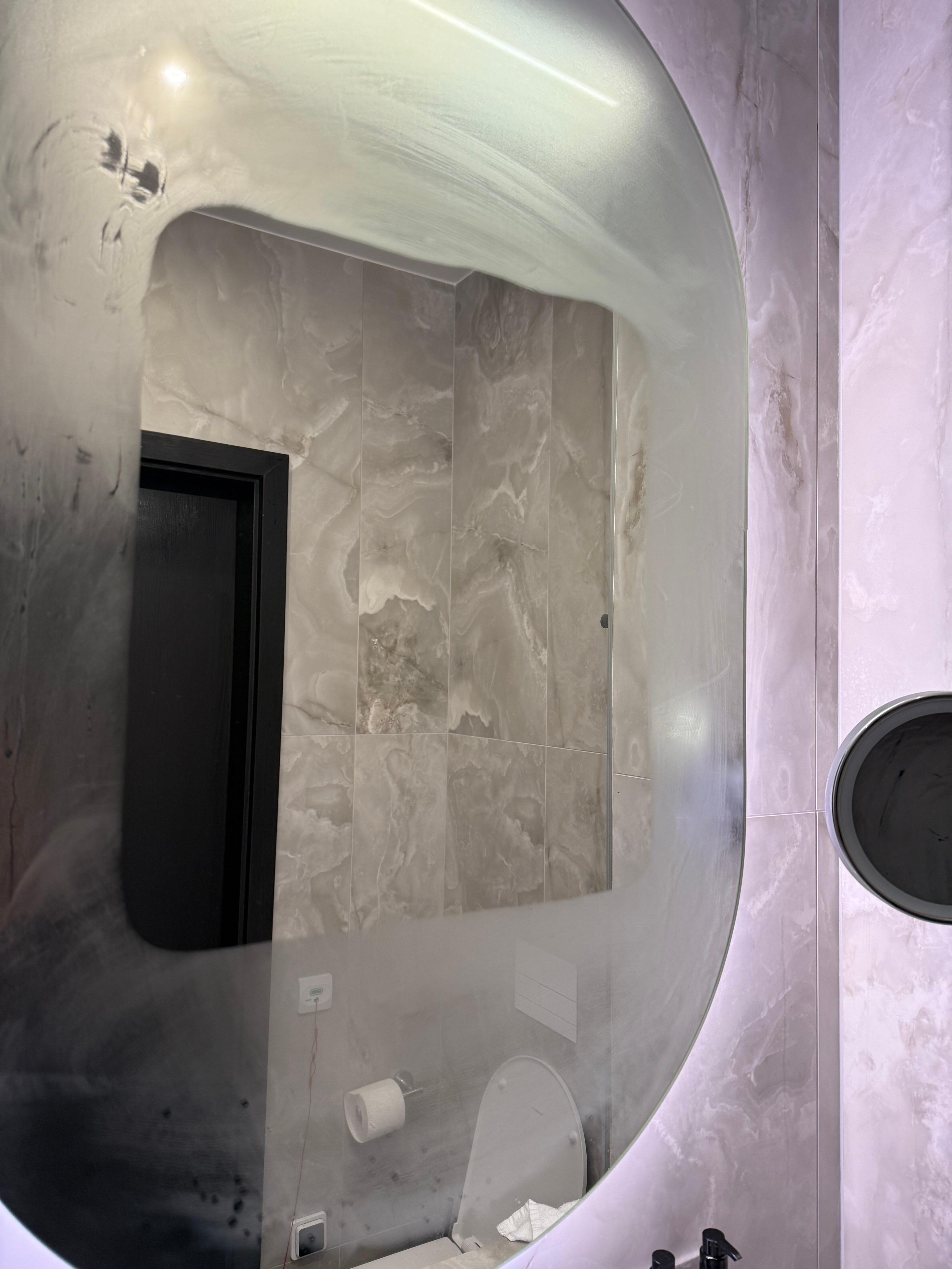 Modern bathroom with heated mirror.