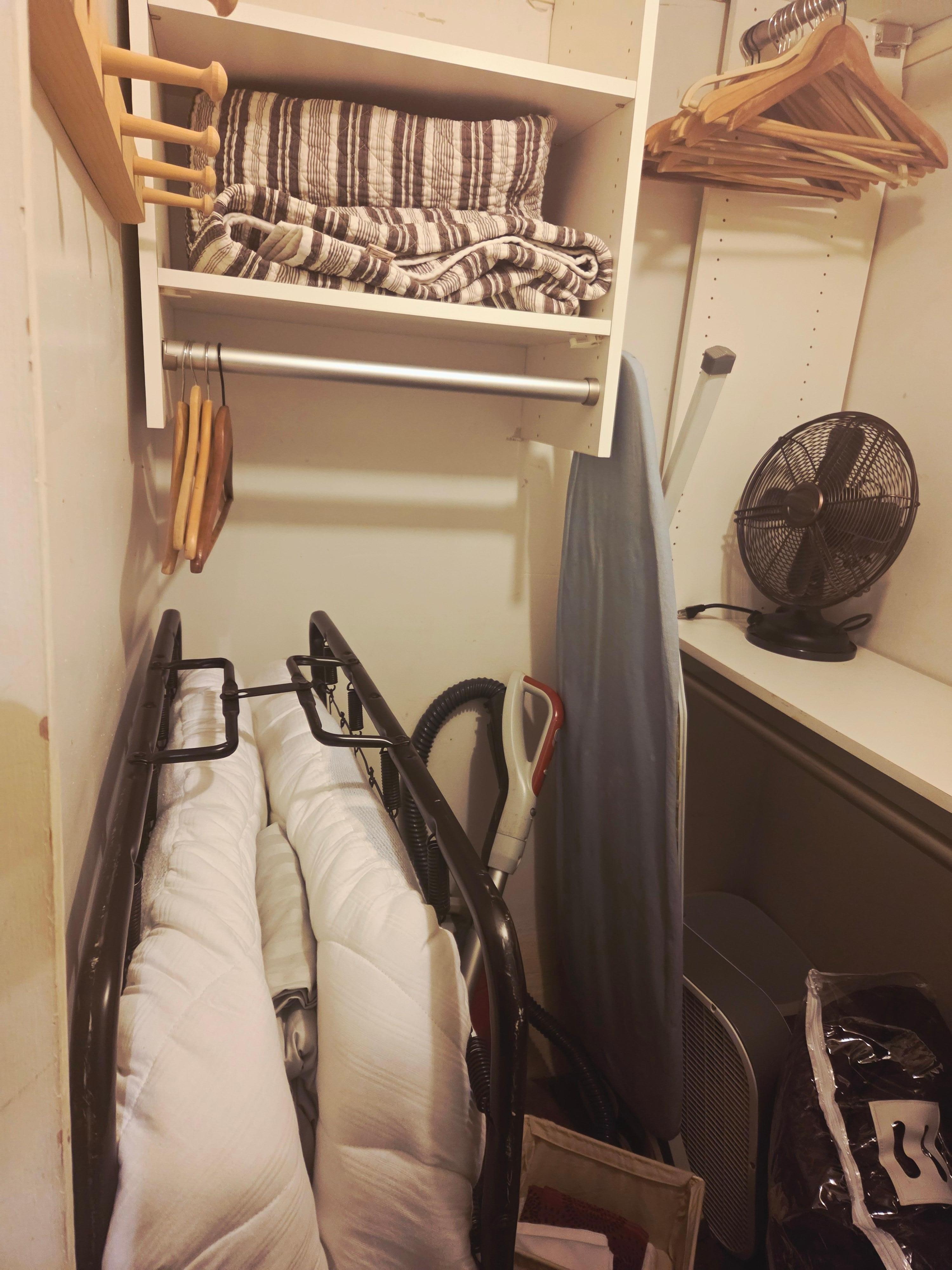 Hall storage closed - only hanging spot for clothes.