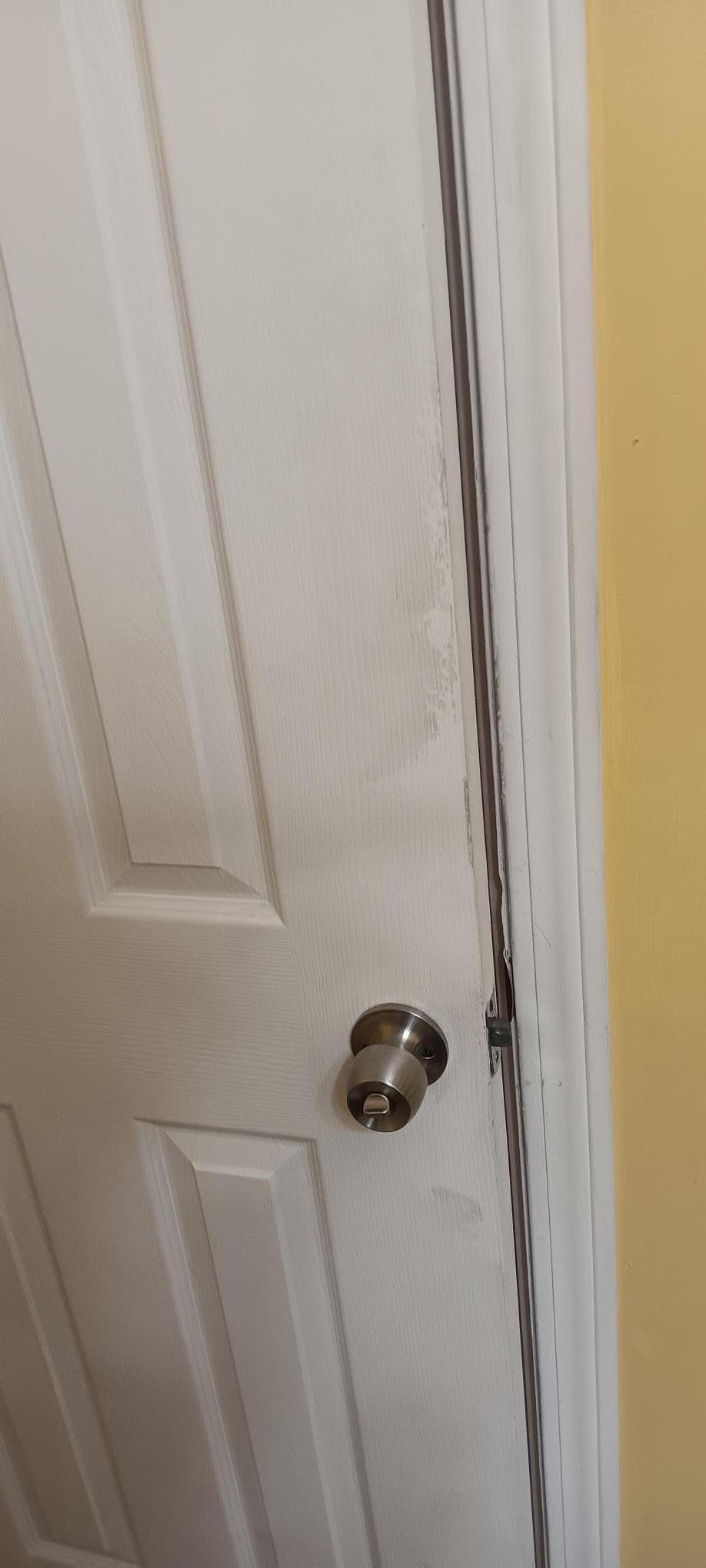 Bathroom door gooey and sticky. It wash off with soap and water... gross!