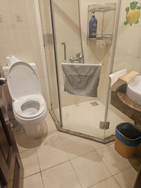 Bathroom with leaky toilet, and no handsoap.