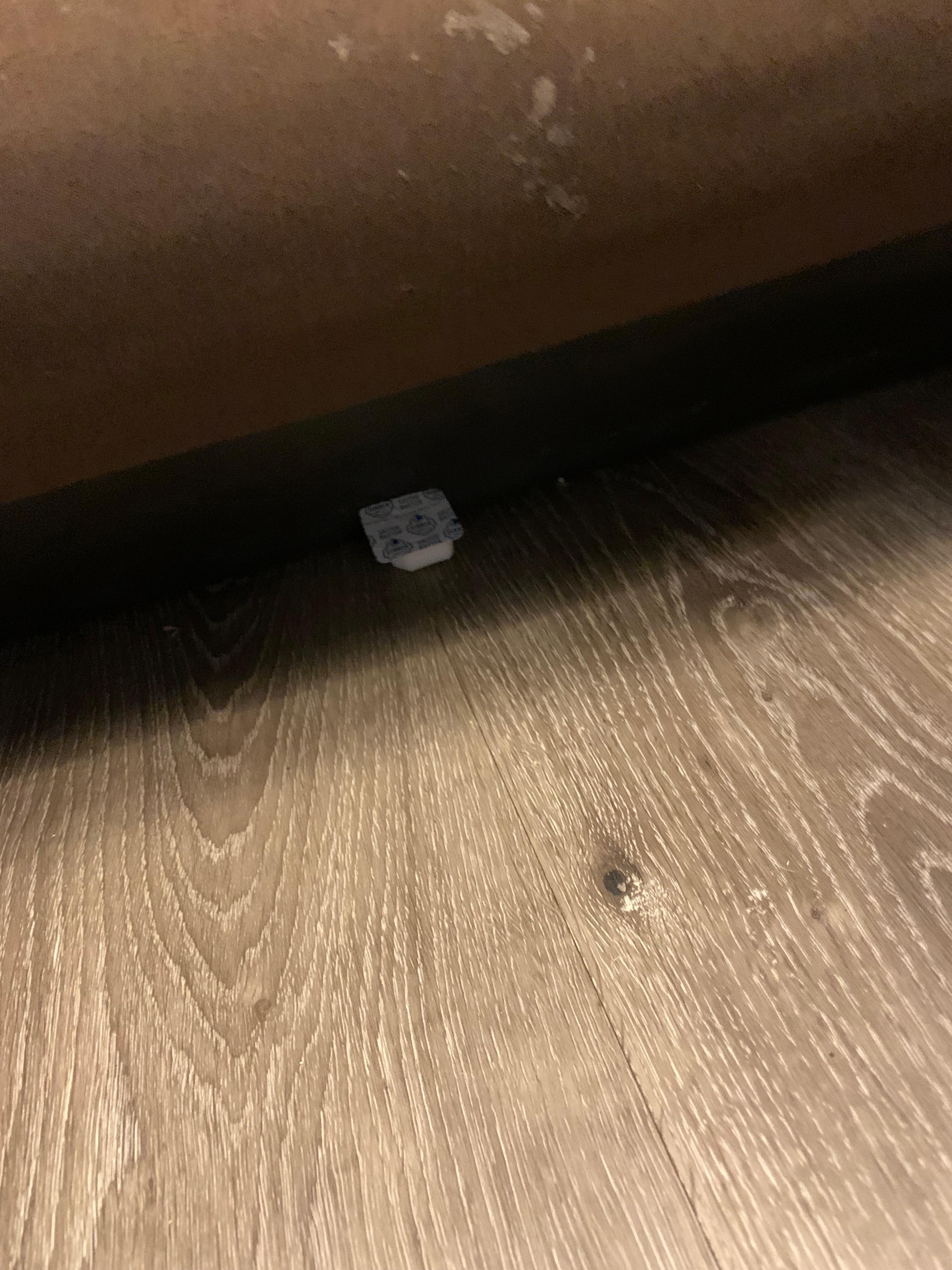 Old butter container under the   other side of bed