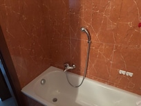 Shower head at it max height on the wall
