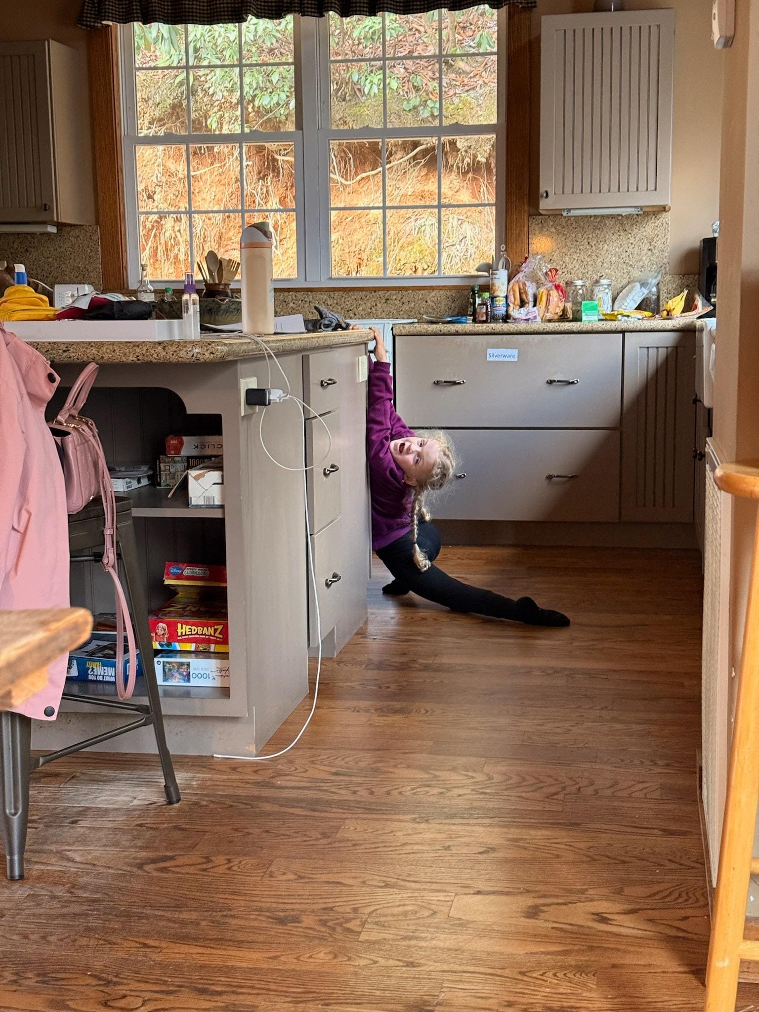A shot of the kitchen and my very dramatic daughter 