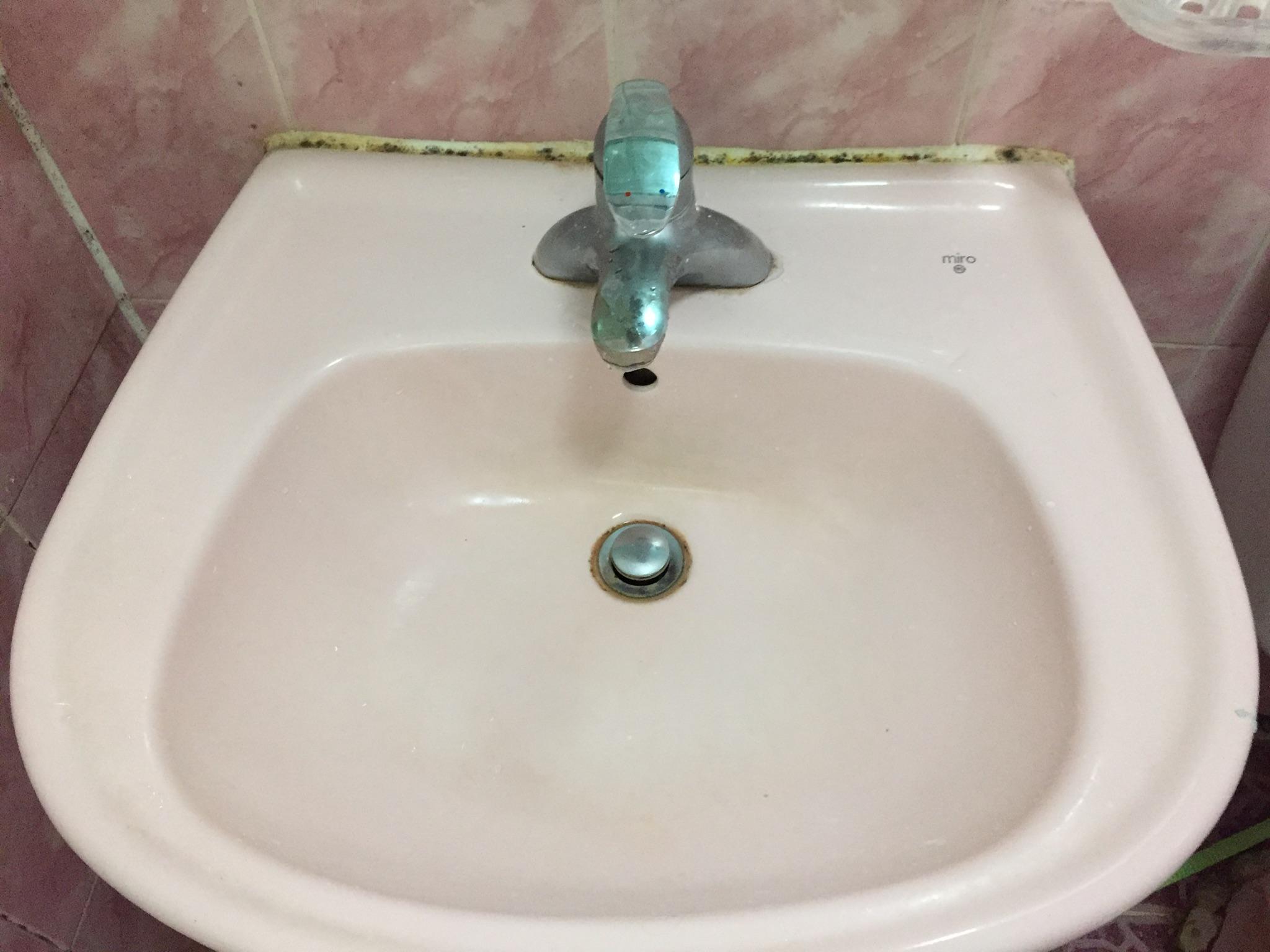 The sink in the bathroom. Pretty sure that’s mold on the grout. 