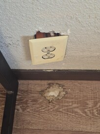 Plug was out from wall with water damage to the floor under it.