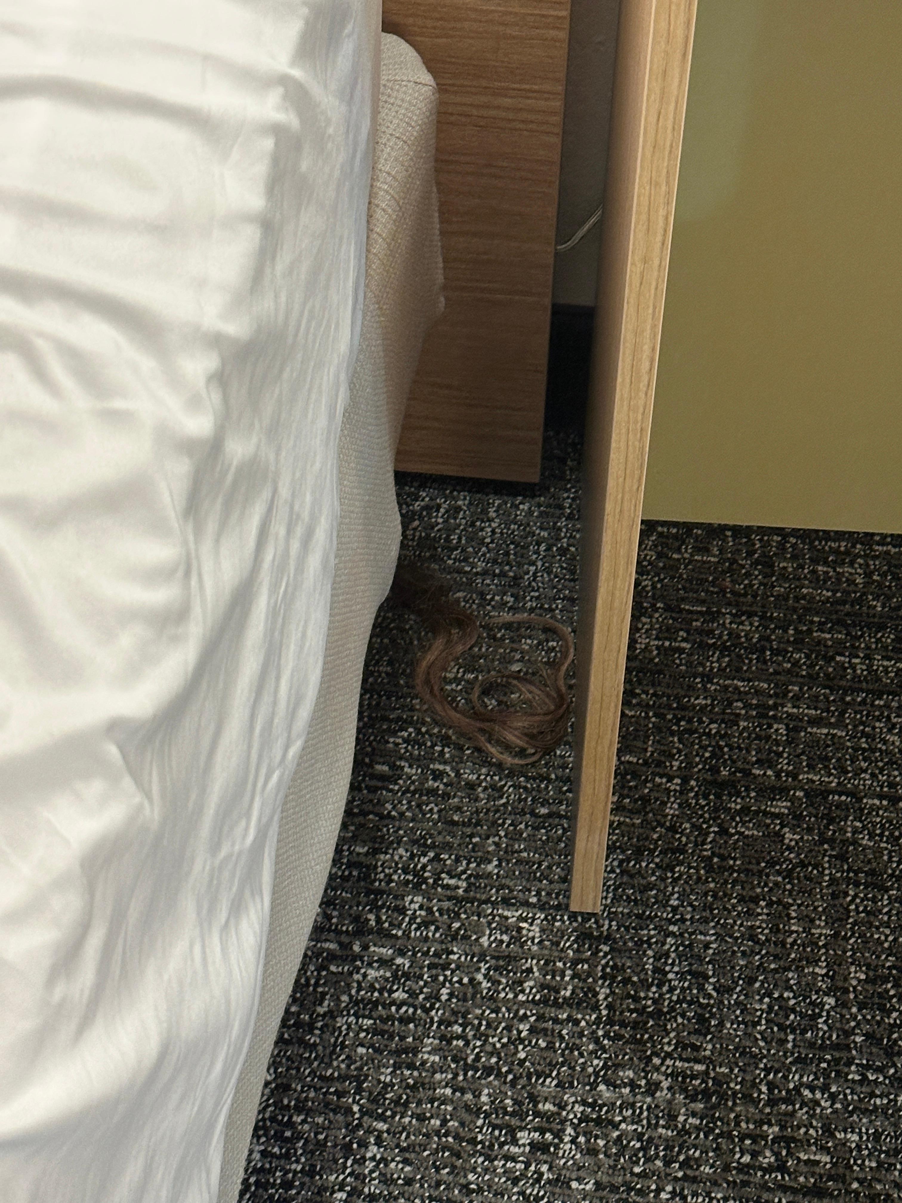 Hair piece between bed and bedside table