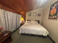 Large room with king bed.