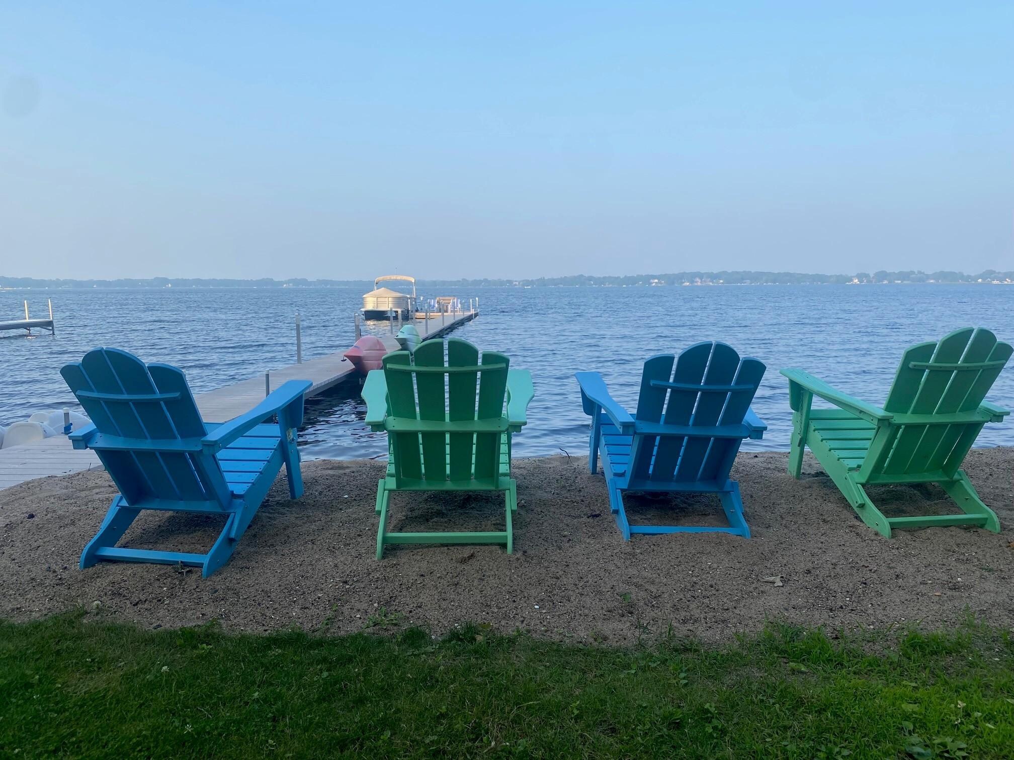 Sturdy/well-built Adirondack Chairs right on the beach and additional ones by fire pit area.