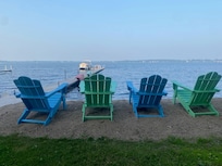 Sturdy/well-built Adirondack Chairs right on the beach and additional ones by fire pit area.
