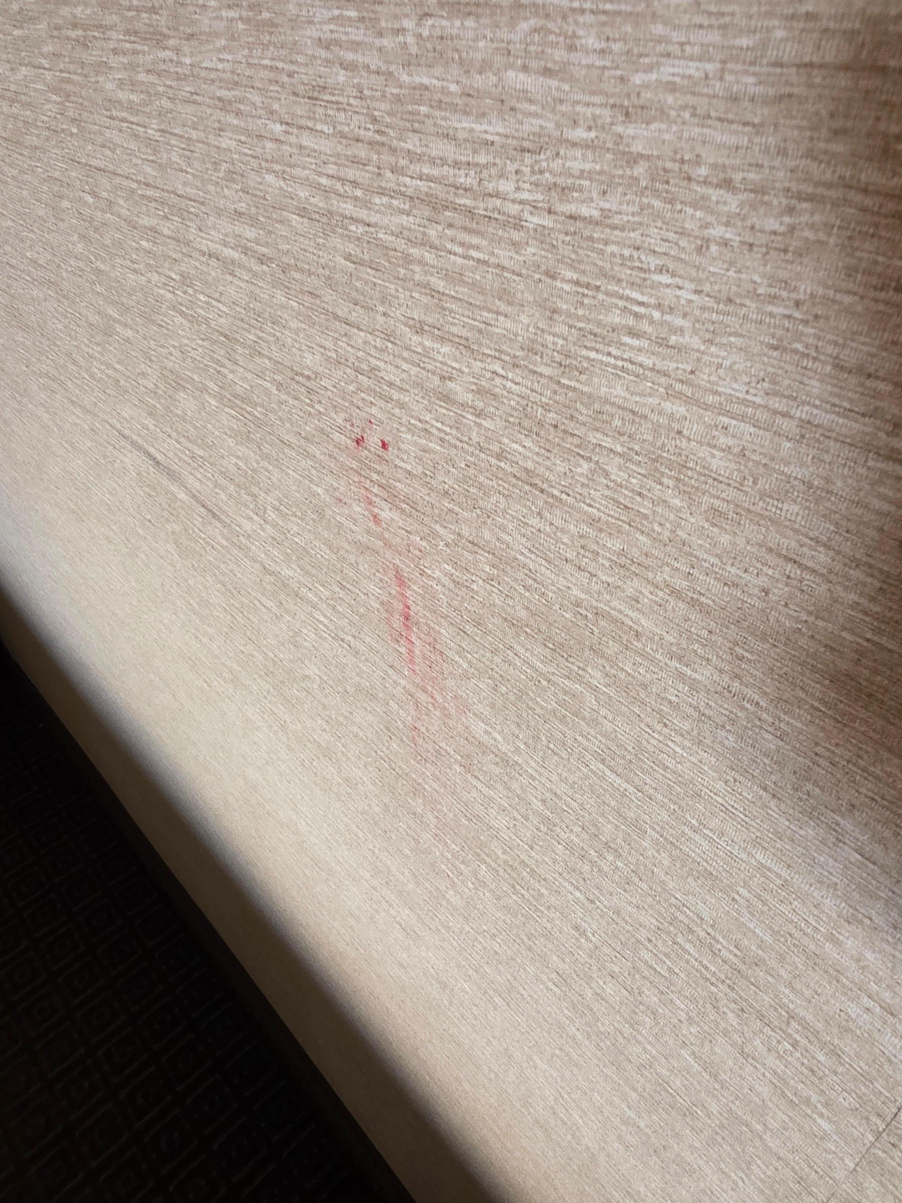 Unknown red substance on the wall