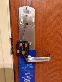 Door lock batteries hanging down when I arrived.