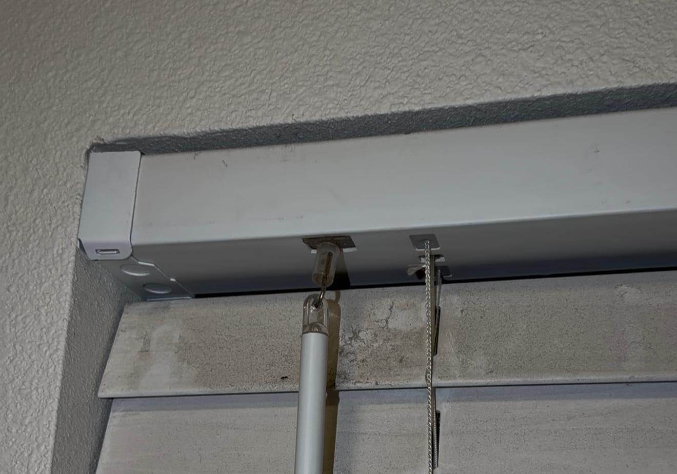 DUST CAKED ON THE BLINDS