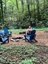 Outdoor fire pit and chairs, perfect for reading or morning coffee.