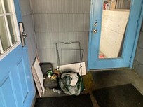 trash piled n front of door