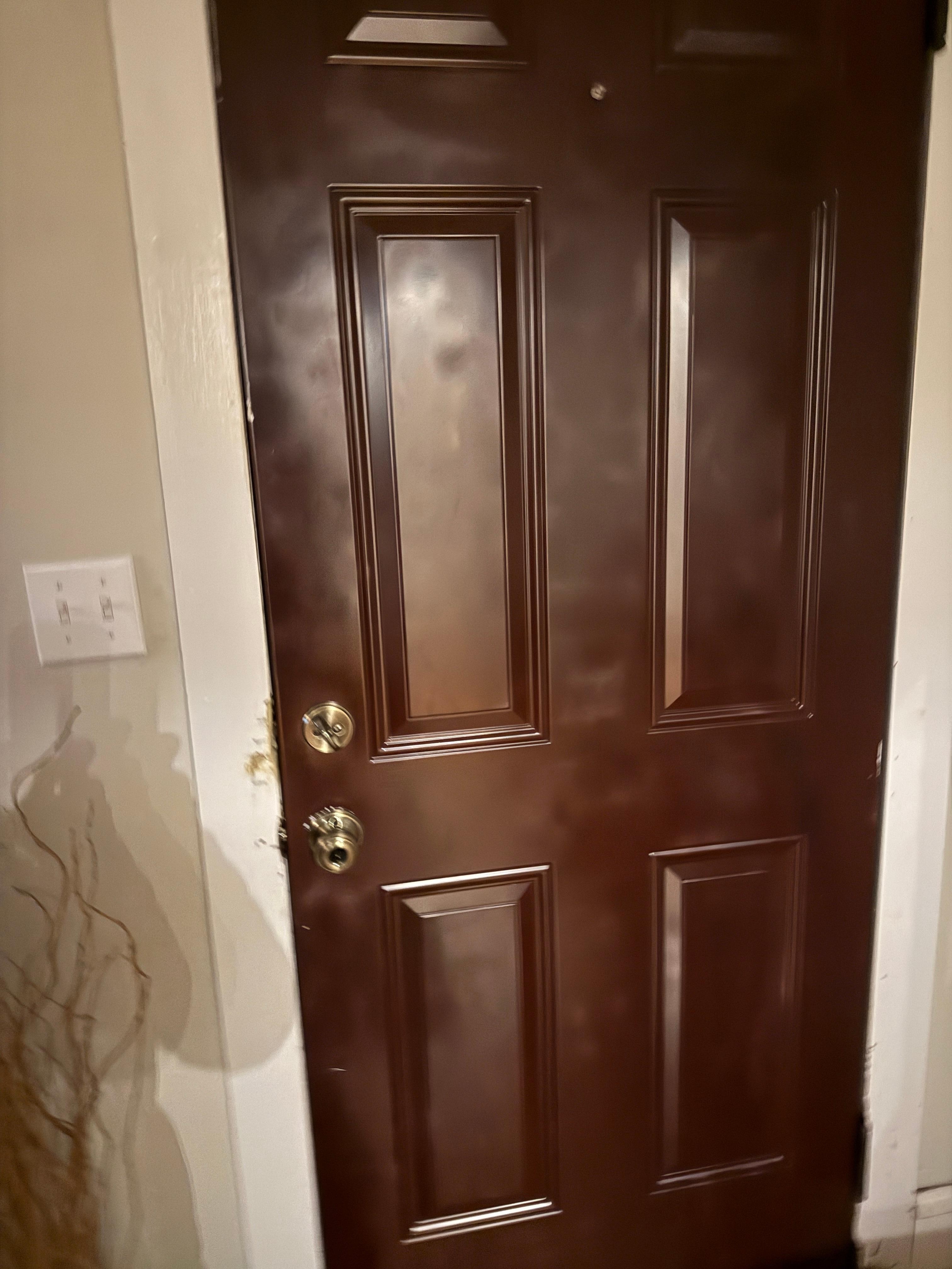 Badly pray-painted front door. Eewww. 