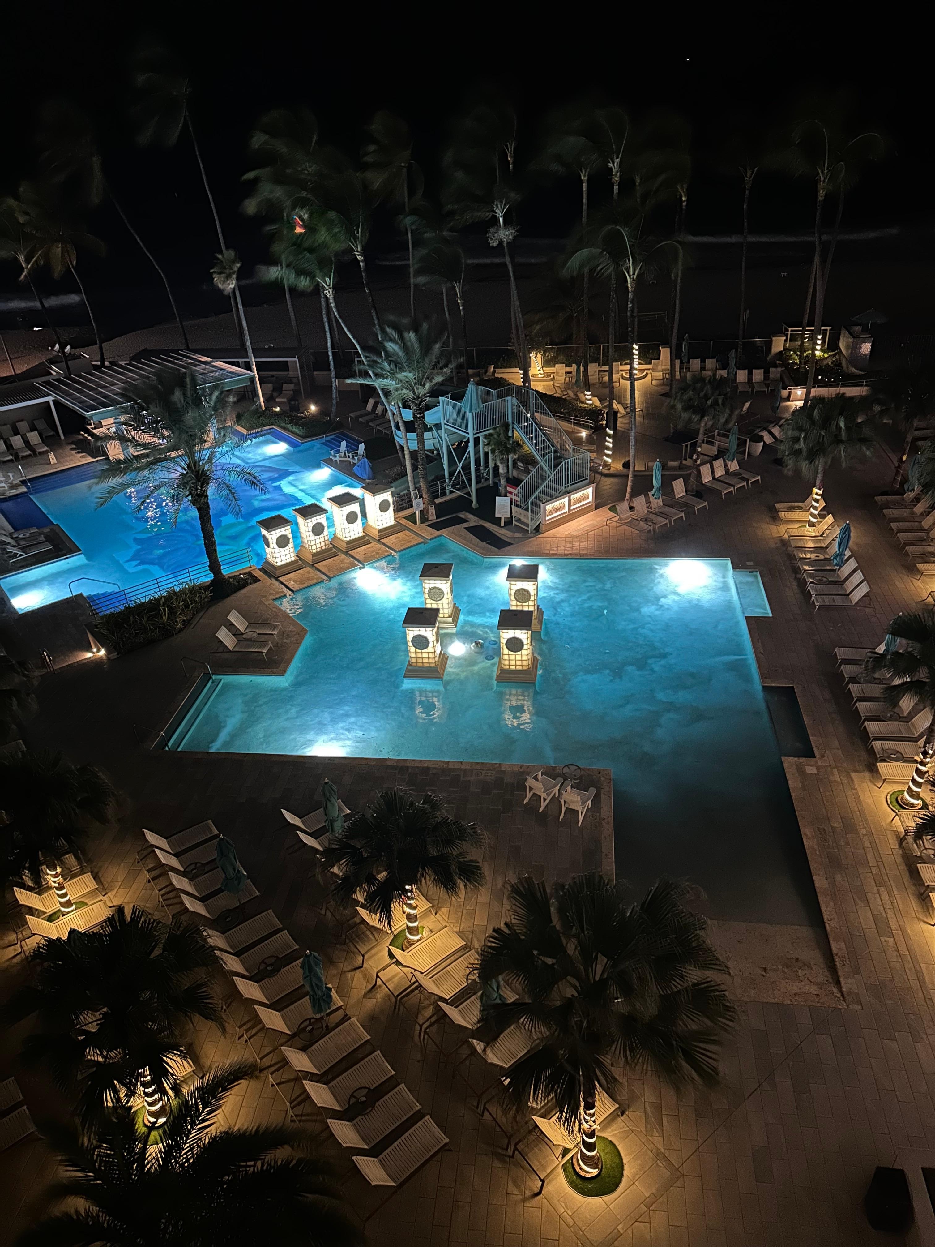 Pool view at night from balcony 