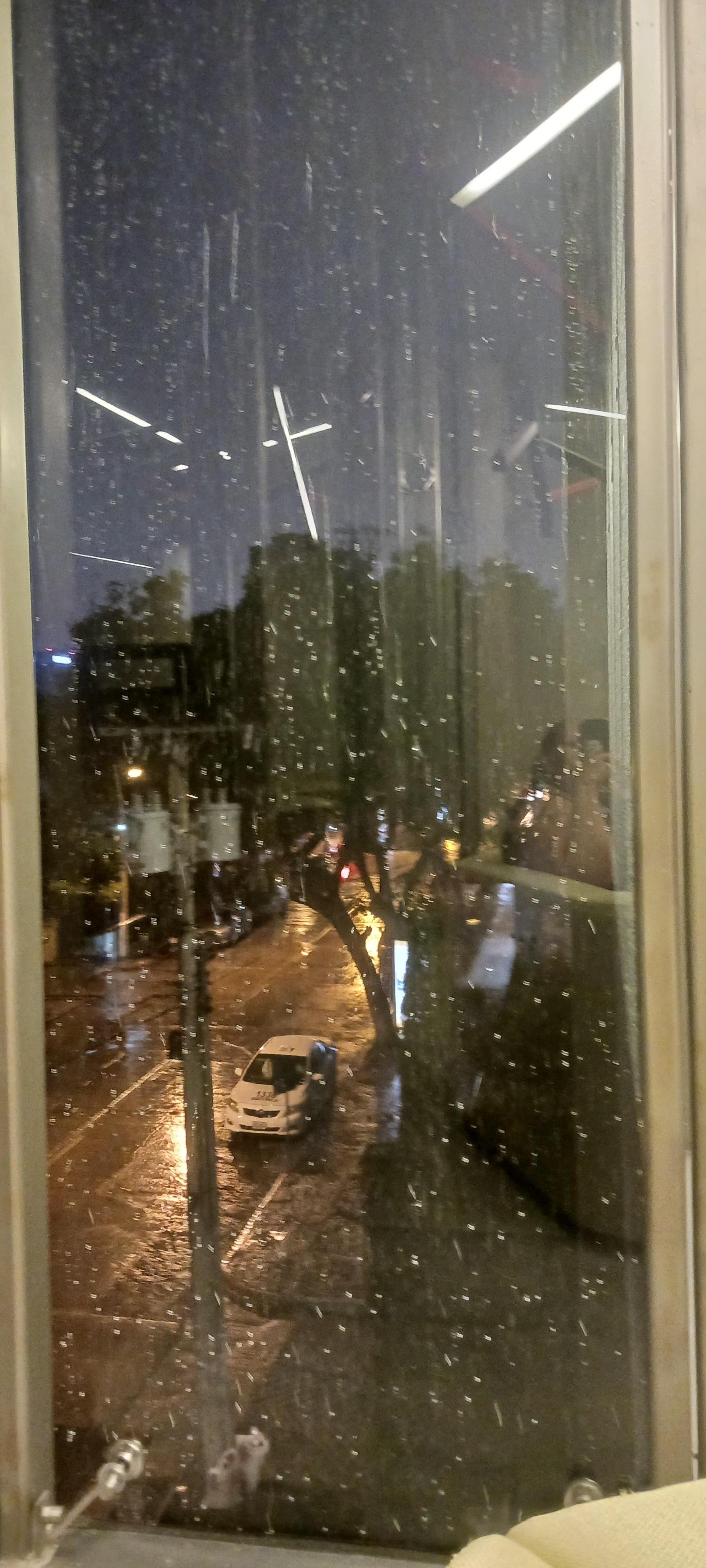 Sitting next to window admiring the view/rain. 