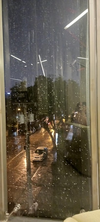 Sitting next to window admiring the view/rain.