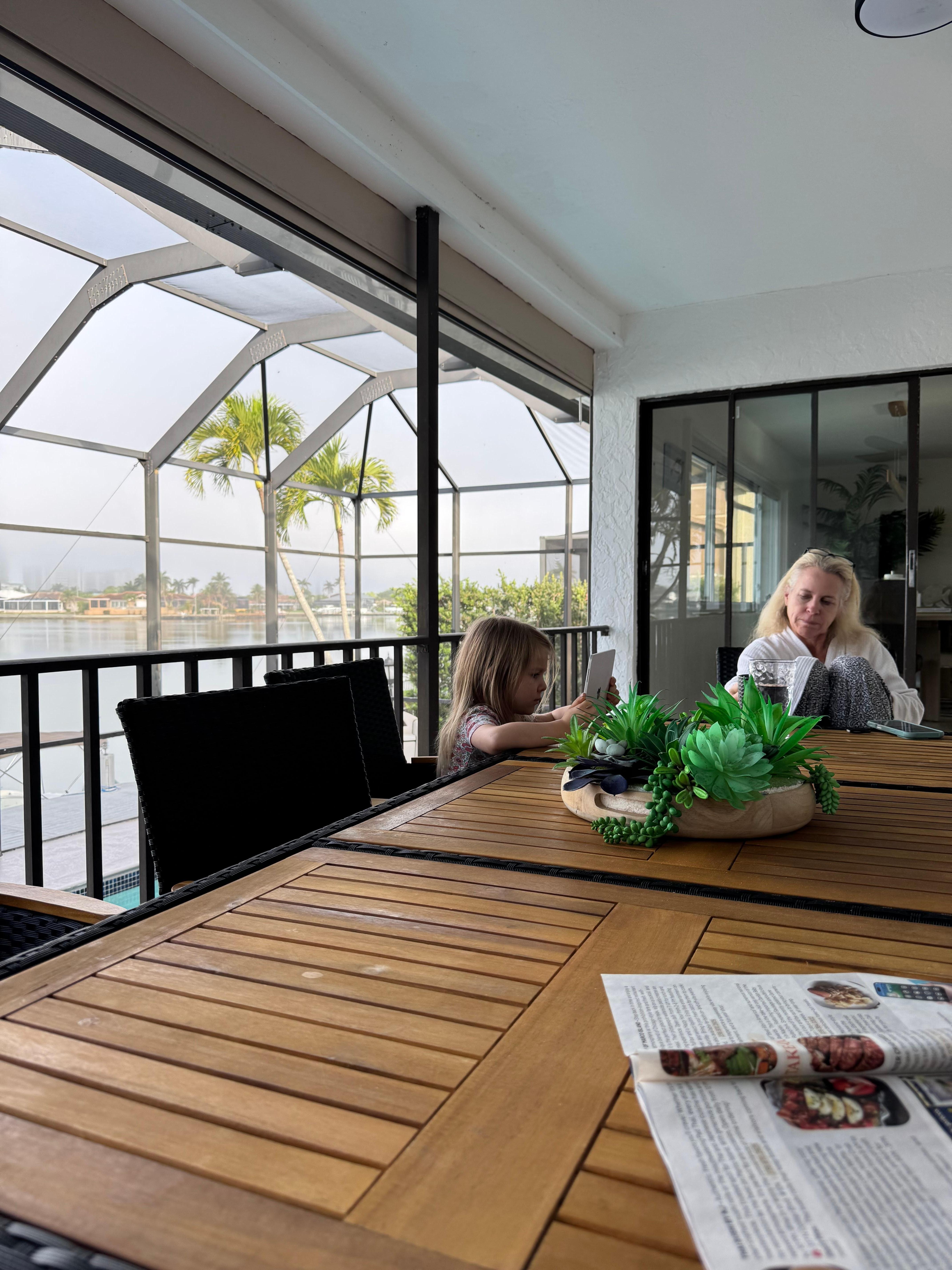 Morning coffee in my PJ’s with my niece.  Not a great photo, but overlooking pool and canal.