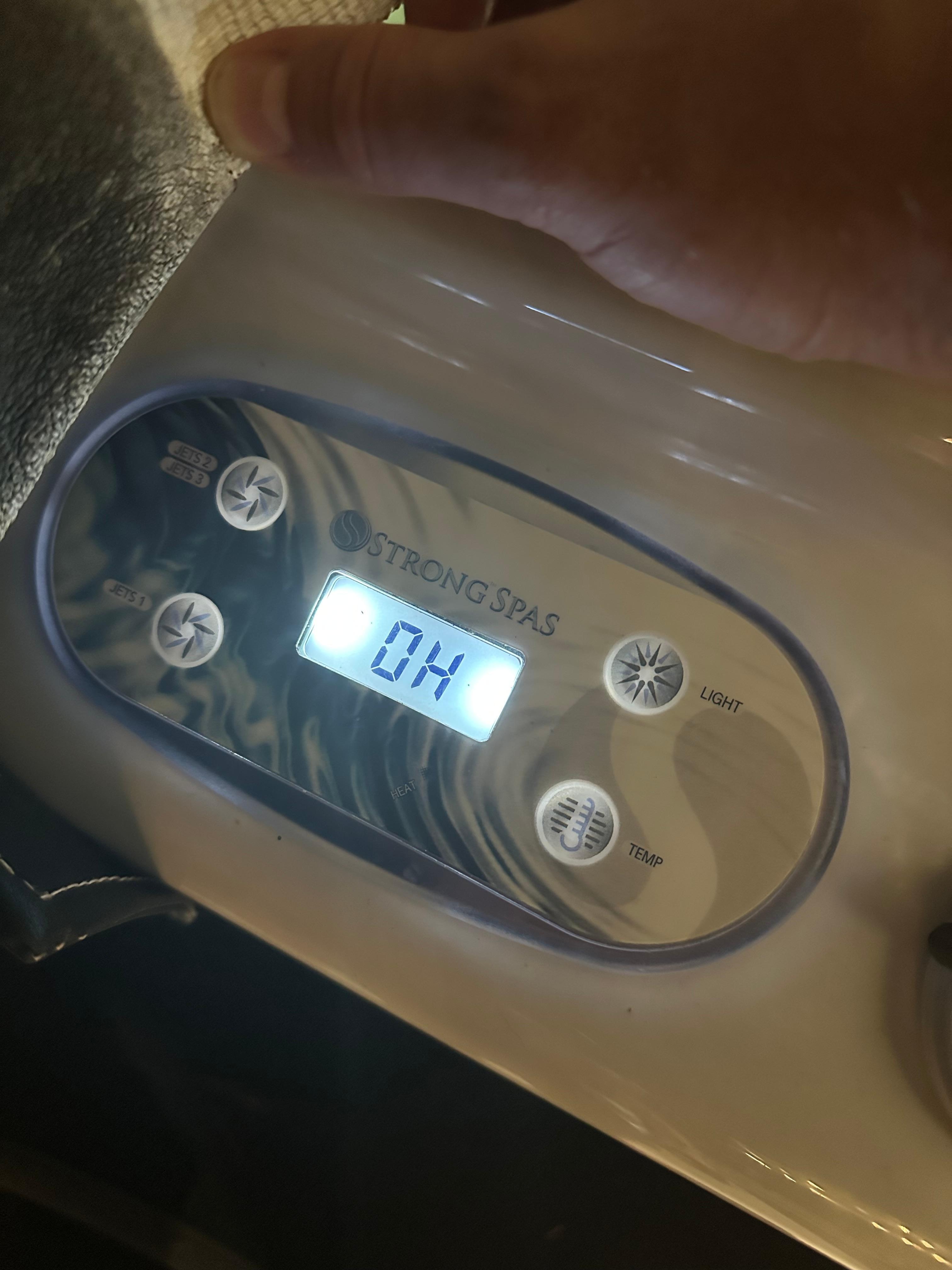 Hot tub showing overheating warning