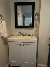 Sink behind the room door and next to the tv was 4ft from the bed.