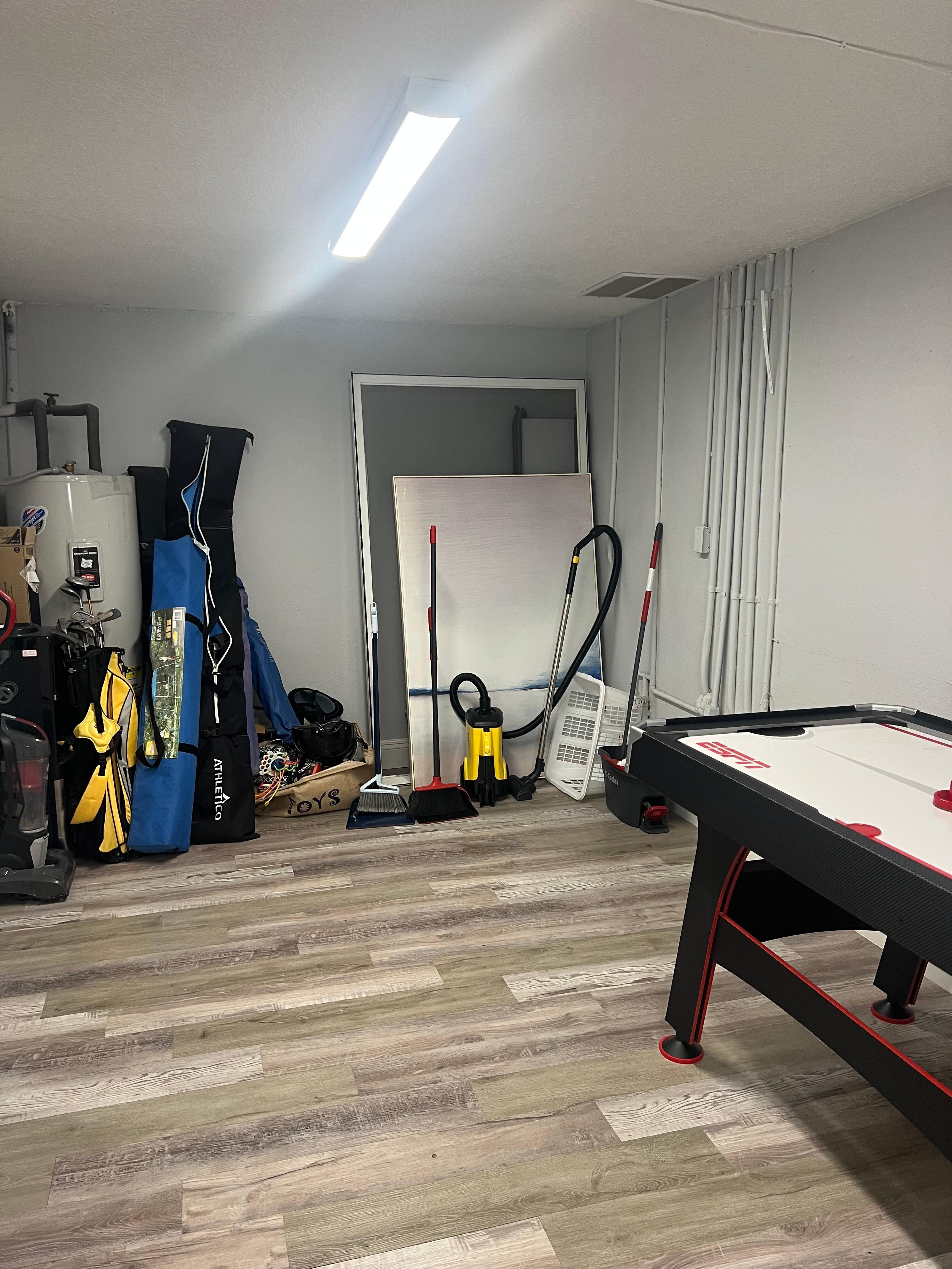 Storage of window screens, vacuums, mops, pictures, etc. in one of the bedrooms