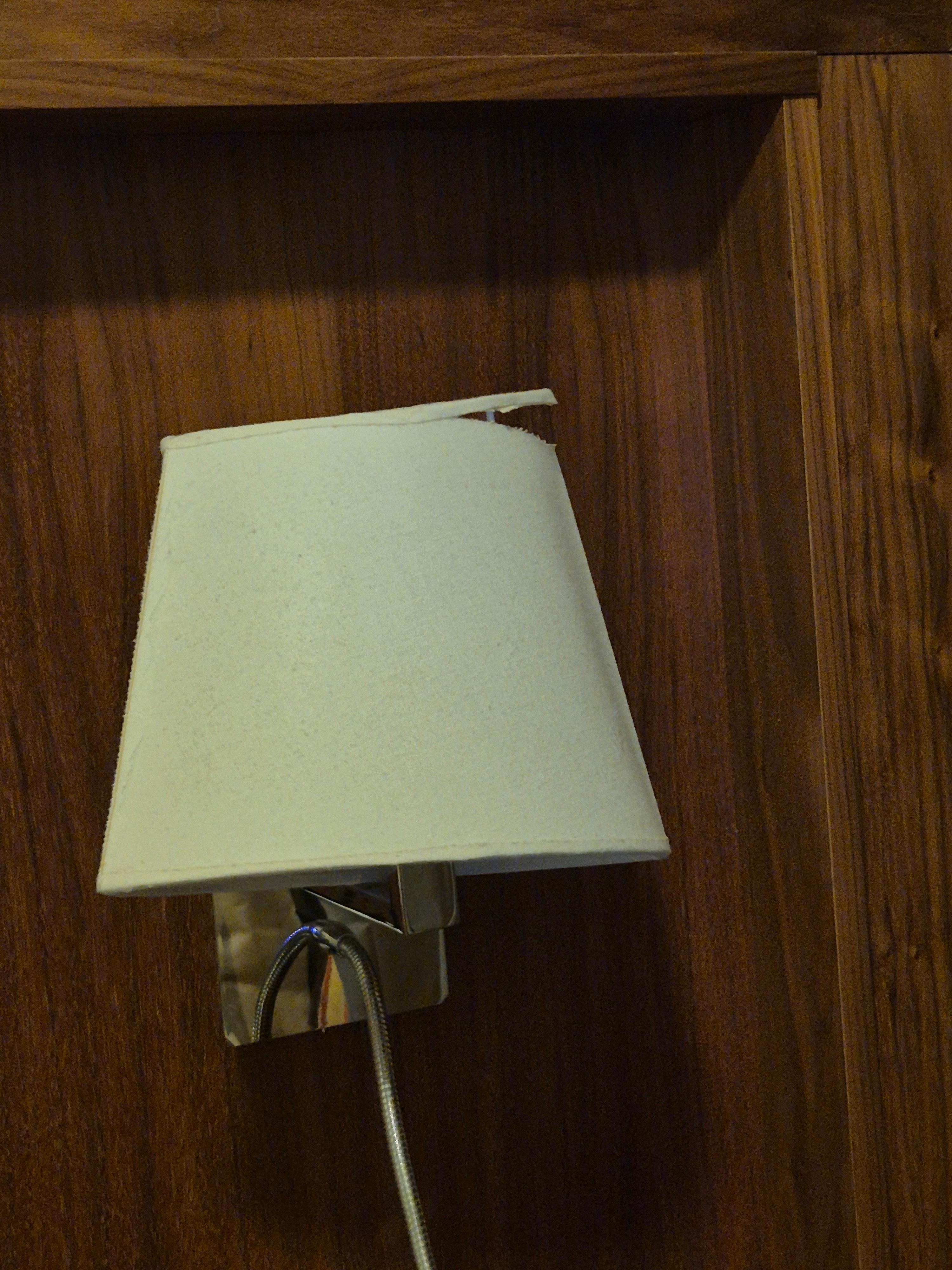 Broken lampshade and broken phone. 