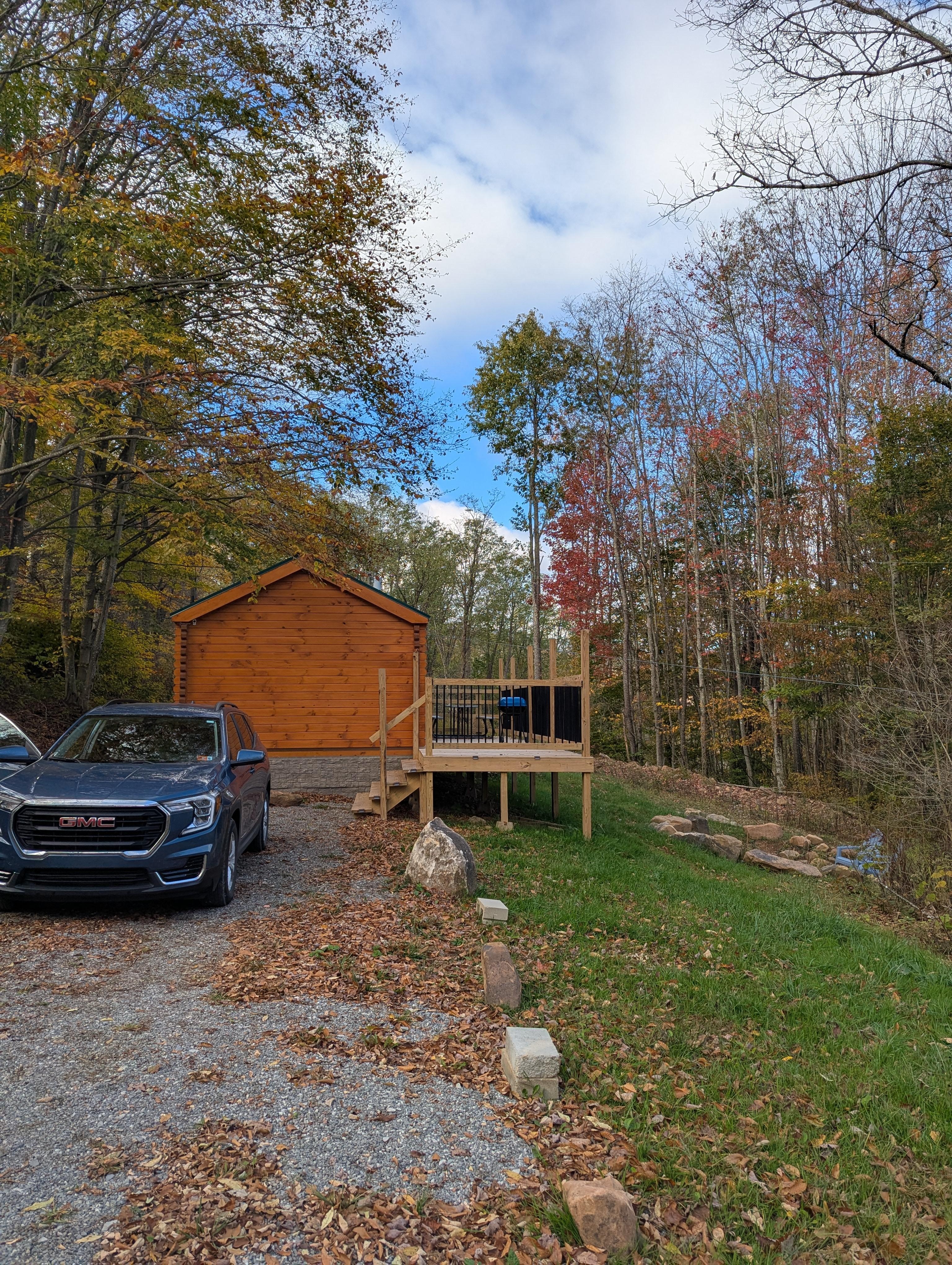 The parking area and stairs to the deck.