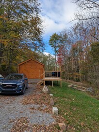 The parking area and stairs to the deck.