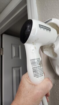 Greasy brown fingerprints on the hairdryer