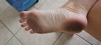 My feet from walking on the filthy tile