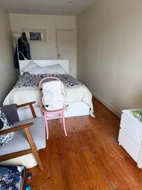 The bedroom - looking towards the stairwell/ hallway to kitchen and bathroom.