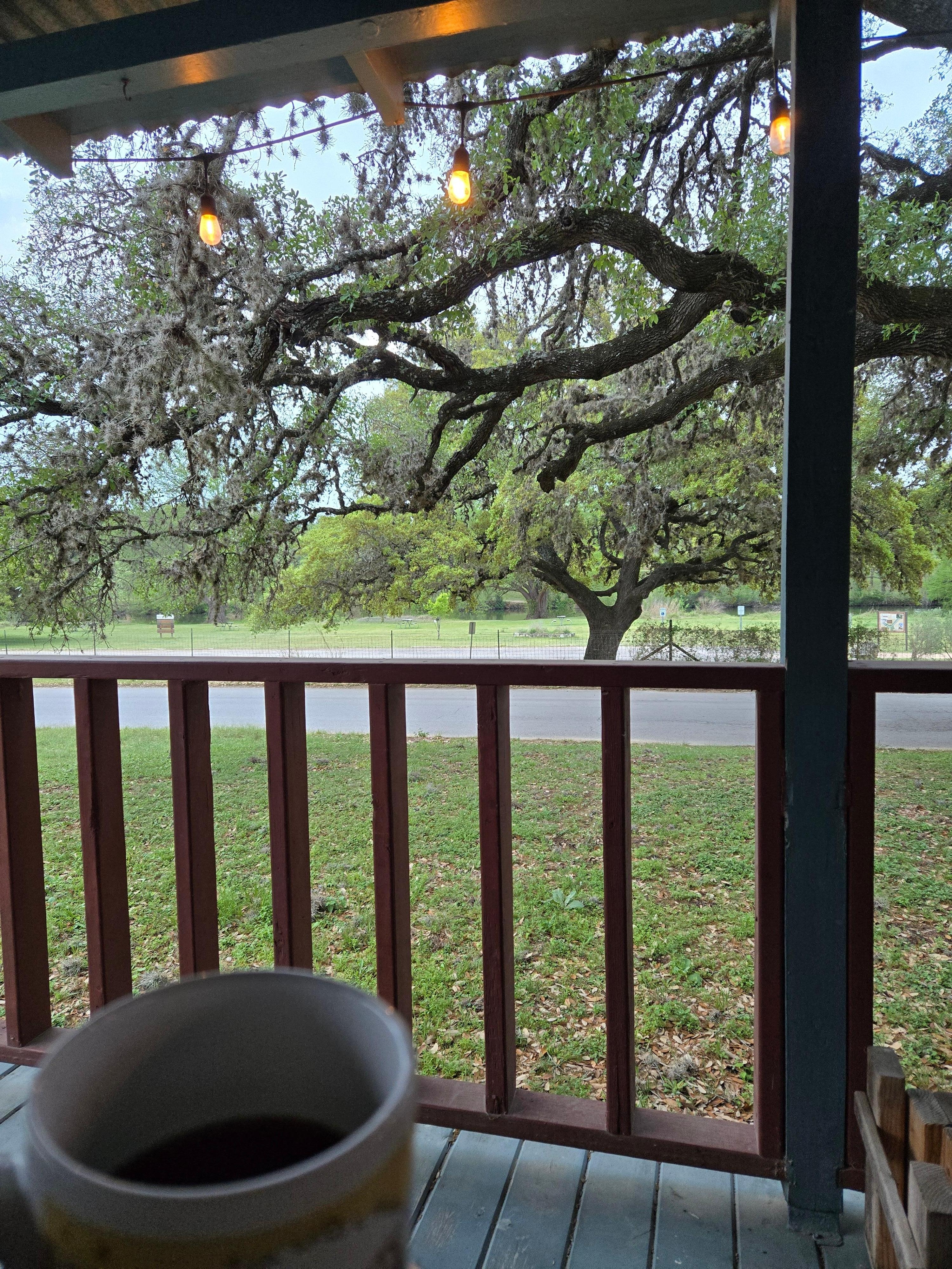 Porch faces the state park and river.