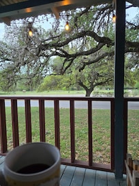 Porch faces the state park and river.