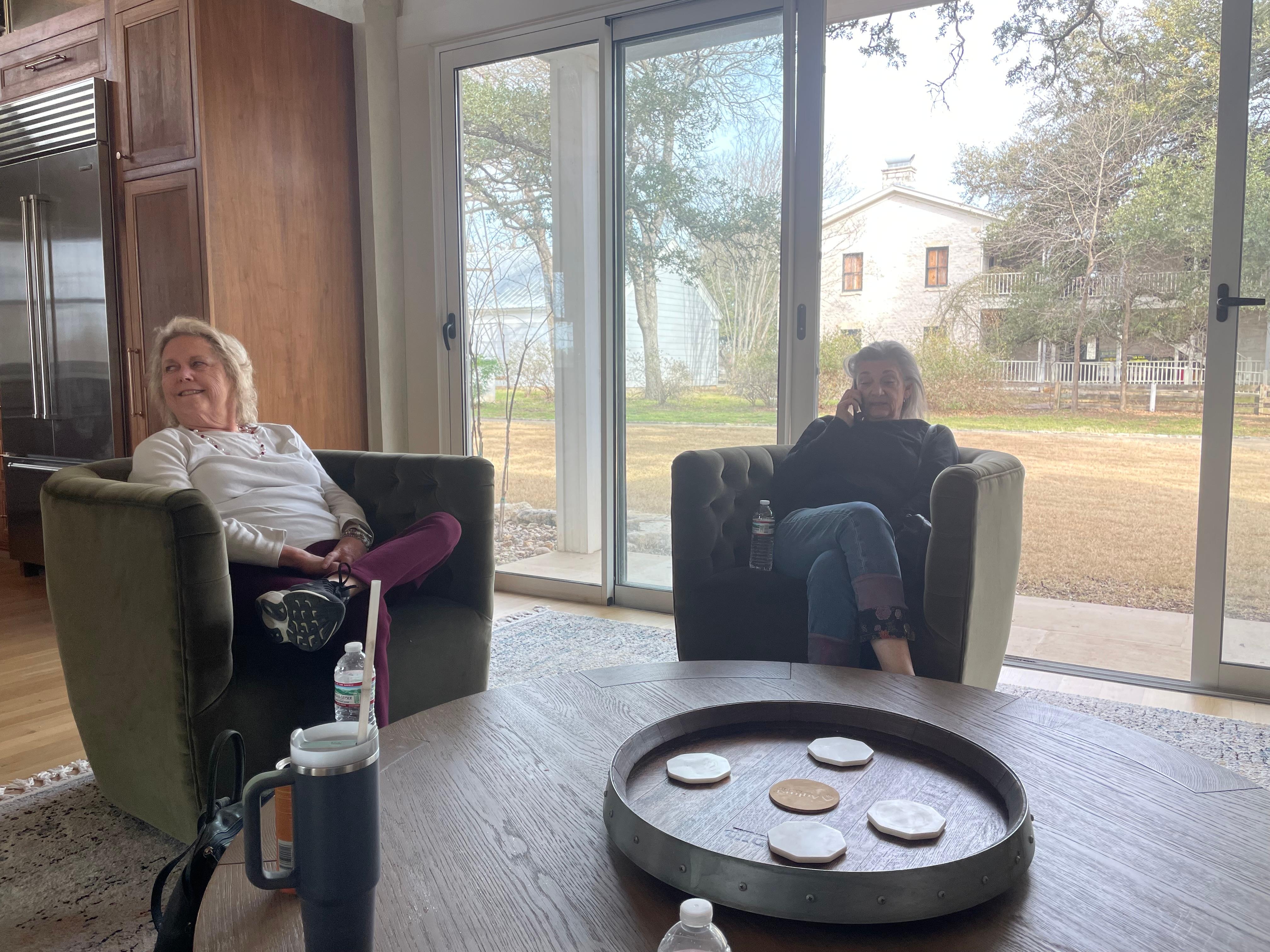 Very modern (with traditional charm) kitchen and large seating area with good light and sliding doors that open. 