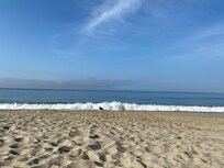 The beach is a 3 minute walk away