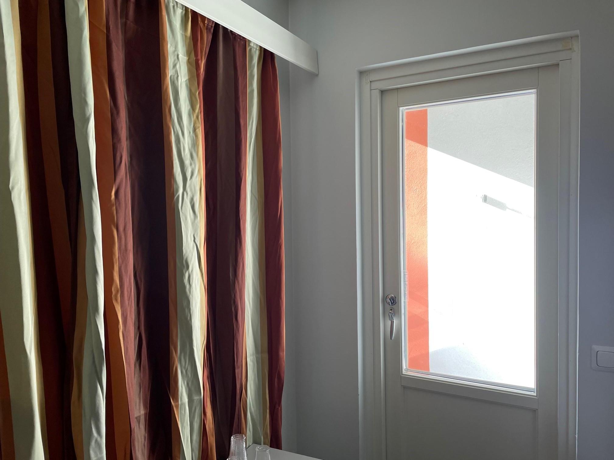 These are the 'improved' curtains - window cannot be curtained in any way...