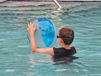 Kids playing with Shepards beach ball
