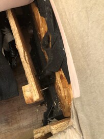 Under the sleeper sofa right side cushion, you can see where the mattress frame has torn away from the main sofa frame