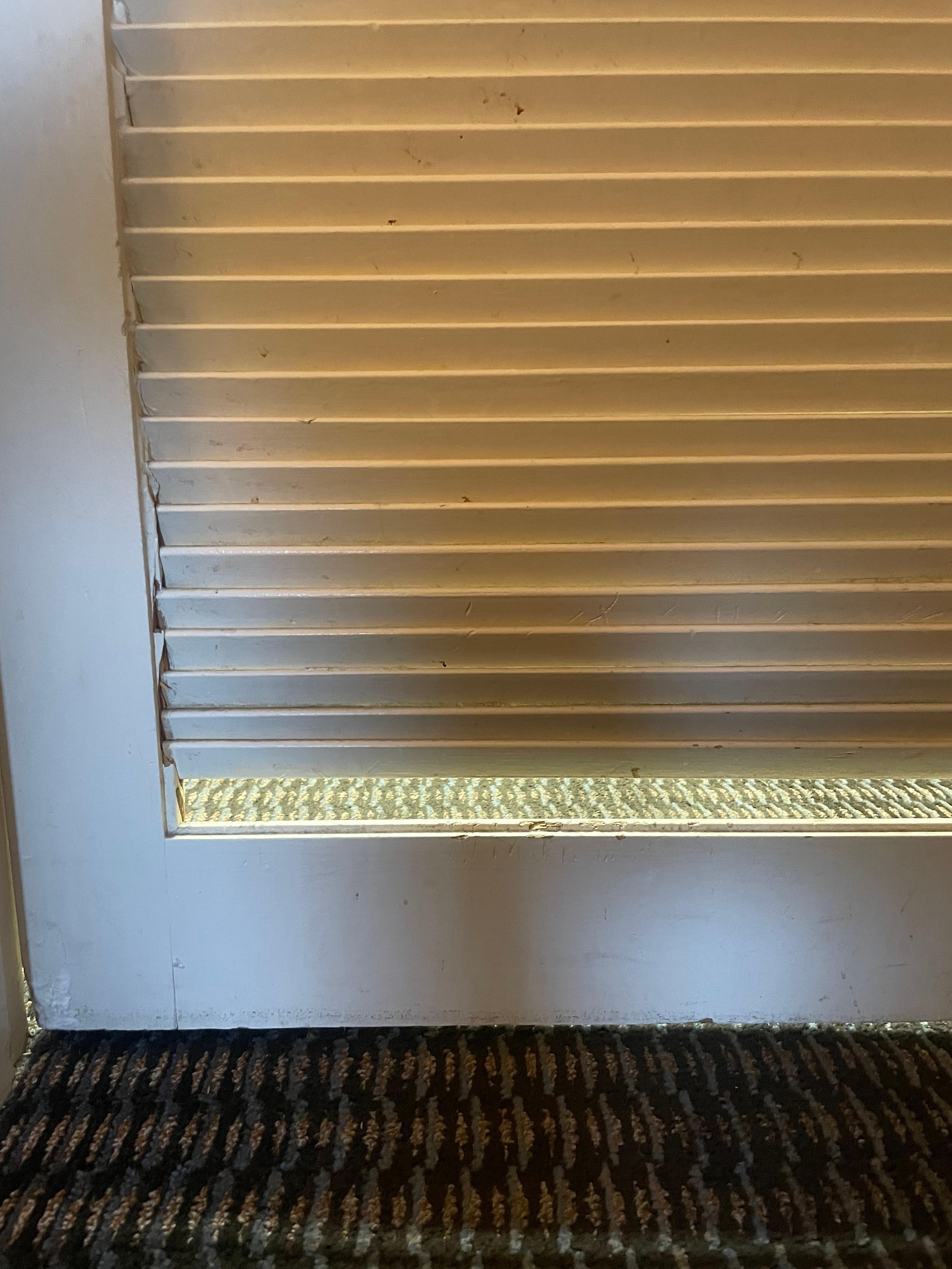 Broken piece of the bathroom door