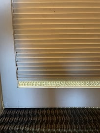 Broken piece of the bathroom door