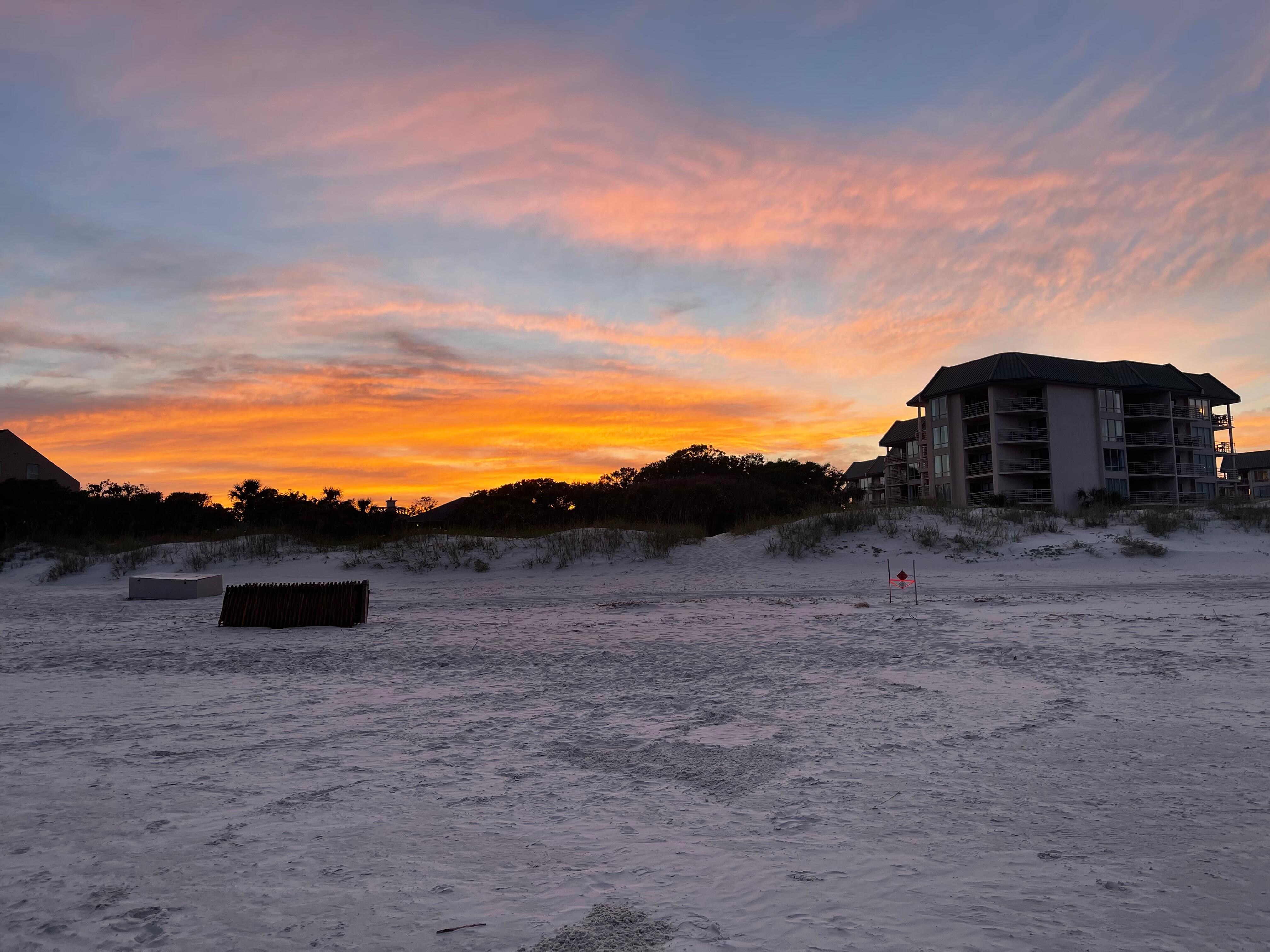 Sunset from Beach with condo building (right)